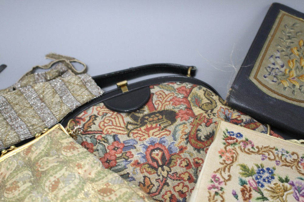 A collection of assorted vintage bags and evening purses